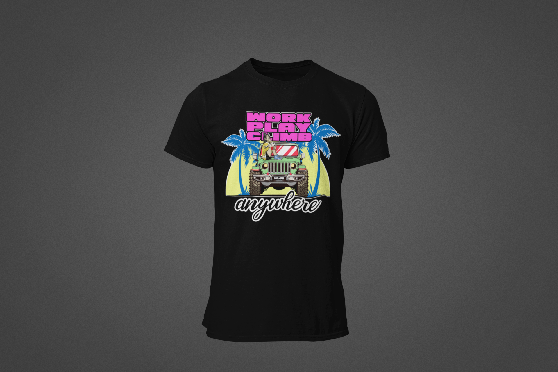 A black tee shirt with the image of a Jeep Wrangler, and text reading "Work, Play, Climb Anywhere"