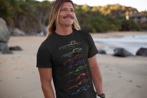 A man standing on a beach, wearing a Corvette tee-shirt, made by 100mph.
