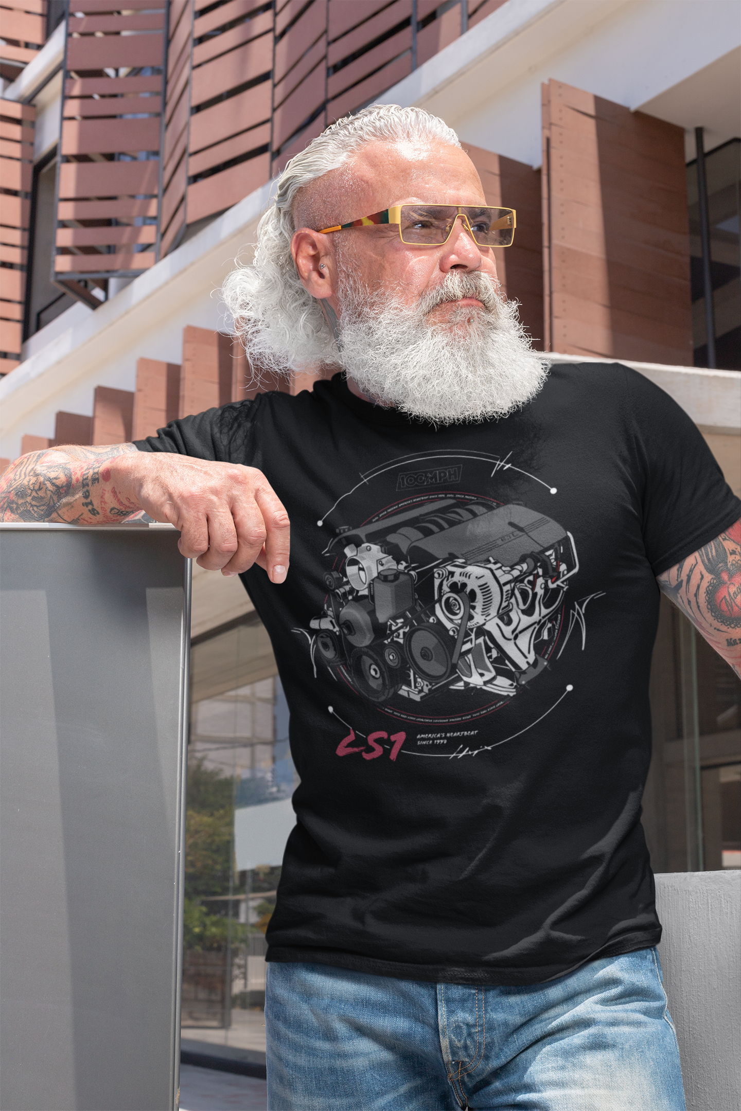 A bearded man, wearing a tee-shirt with a Chevy LS1 engine printed on the front. Made by 100mph